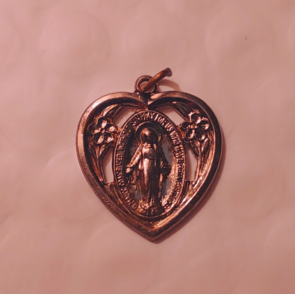 Mother Mary Miraculous Medal in a Sacred Heart